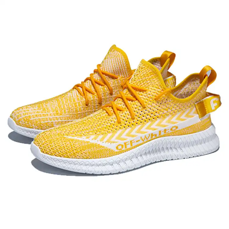 yellow human race trainers