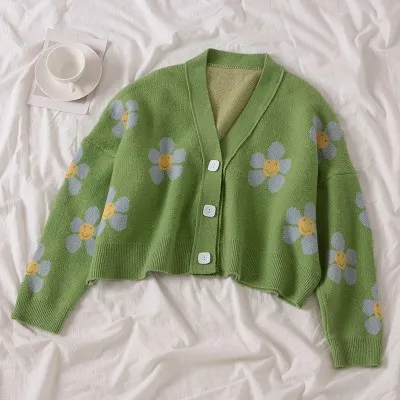 green sweater with white flowers