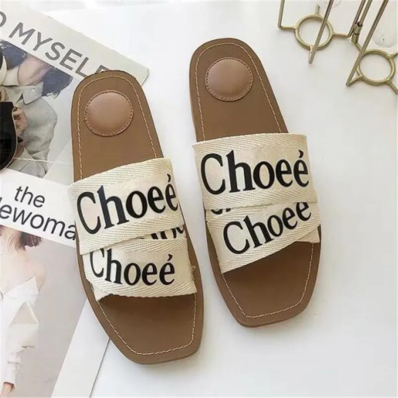 

Europe and the United States 2019 summer new slippers women's fashion wear flat square square beach letter ribbon open toe sanda