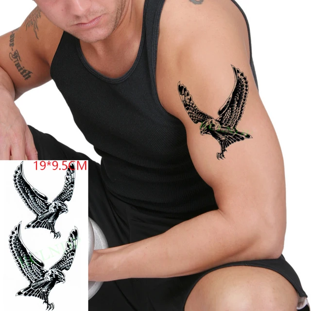 Small Black Silhouette Flying Eagle Tattoo On Wrist