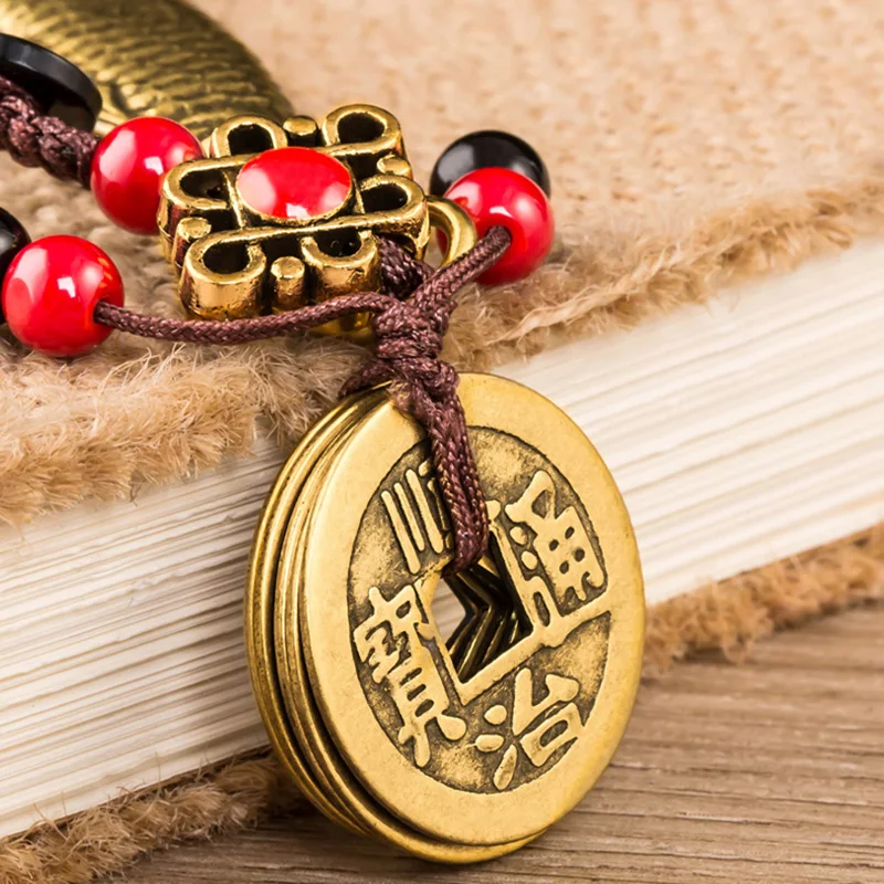 brass fish pendants (4)