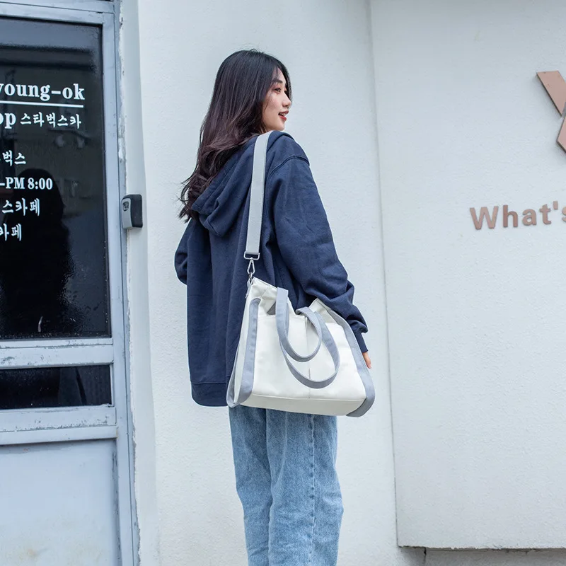 

Japanese Canvas One-shoulder Messenger Bag Large-capacity Hit Color Handbag Fashion Trend
