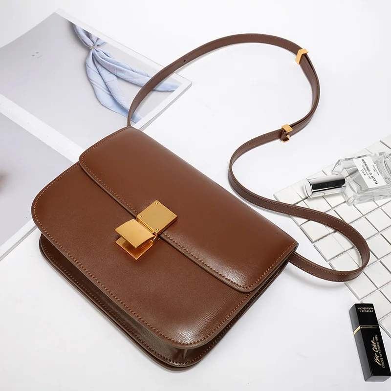

Single Shoulder Cowhide Spring Buckle Woman