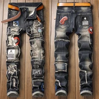 Men’s luxury hole ripped retro jeans distressed badge patched embroidery denim pants slimming hard washed casual jeans pants 1