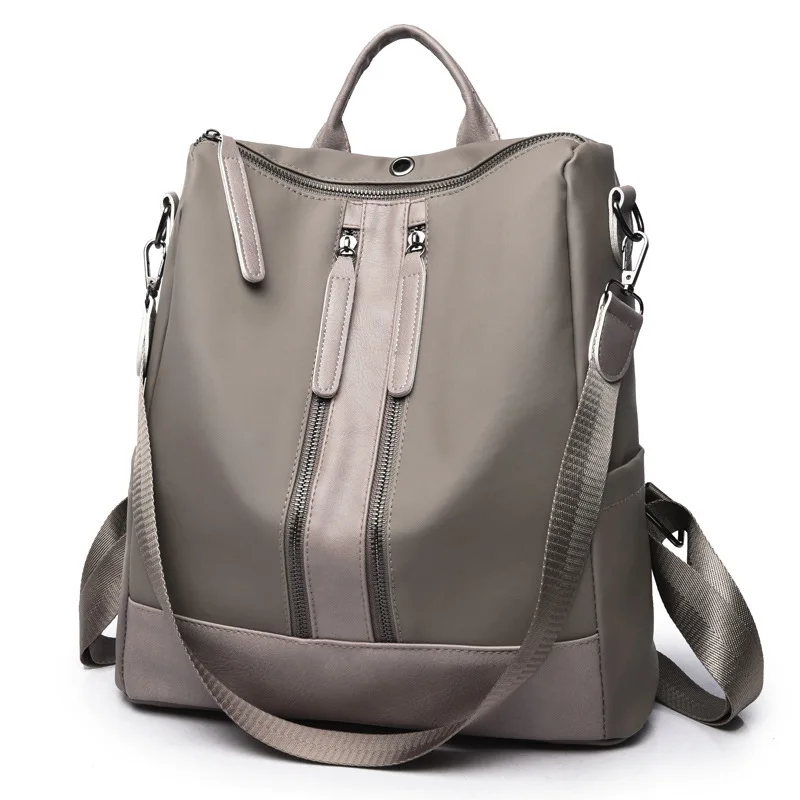 

Simple multi-functional Backpack New Oxford cloth double zipper simple fashion backpack cool fashion headphone hole design