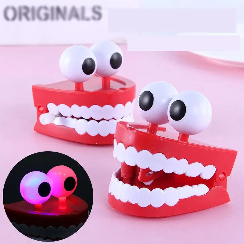 

Ant Glowing big white teeth clockwork toy tidy strange novelty fun boring decompression gift artifact Anti Stress Tooth Juguetes