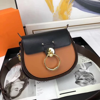 

2020 new small round bag, one shoulder, slant span, mini pig, round ring, color matching, leather, white and wide shoulder belt