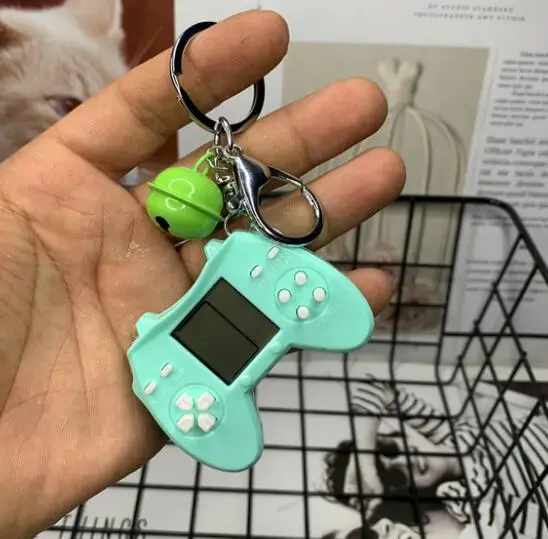 Retro Console Game Keychain Built-In 7 Games Puzzle Video Game Mini Handheld Game Console Pendant New Year Xmas Gift For Kids 
