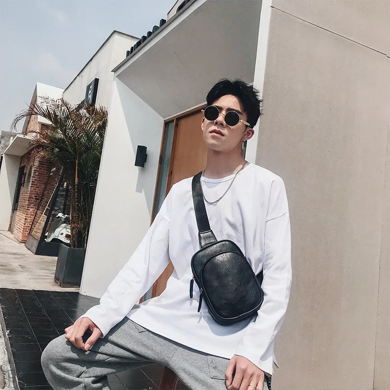 

The new Korean men's and women's breast bags are small retro fashion backpacks