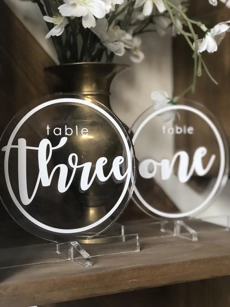 Round Clear acrylic table numbers with modern font.