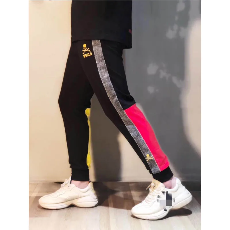 

Men Pants 19SS Mastermind Pants Autumn Winter Women Embroidered Skulls Mastermind Japan Sweatshirts Custom Ribbon Splice Color