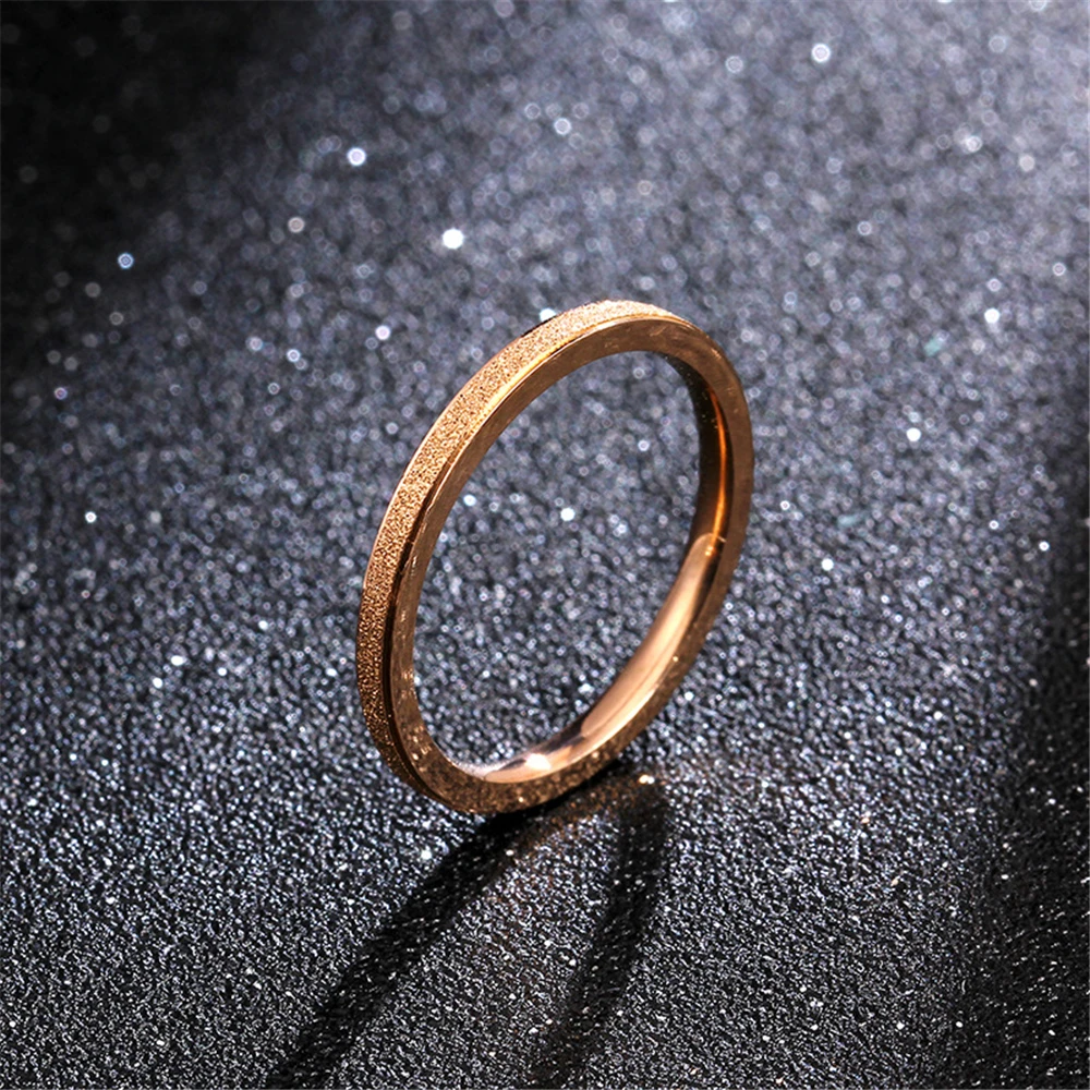 

Loredana Fashionable and simple 2mm width rose gold color gold frosting process to make titanium steel wedding ring.Do not fade