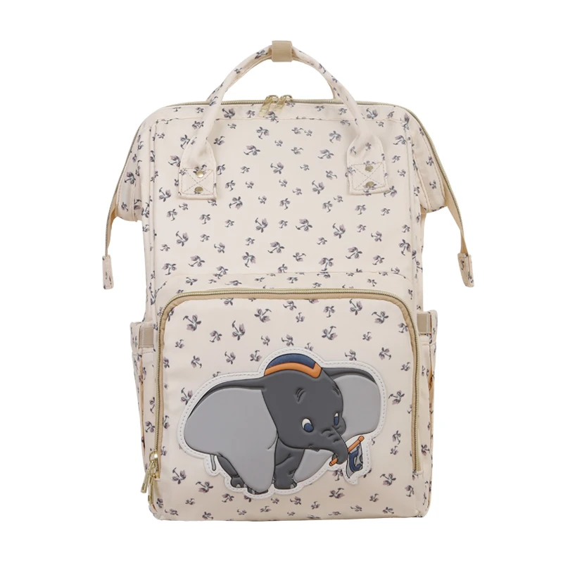 Sac à couches USB Dumbo Beige Disney | Sac à dos étanche, sac à couches/de maternité pour maman, sacs de voyage de luxe, Simba, nouvelle collection 2020