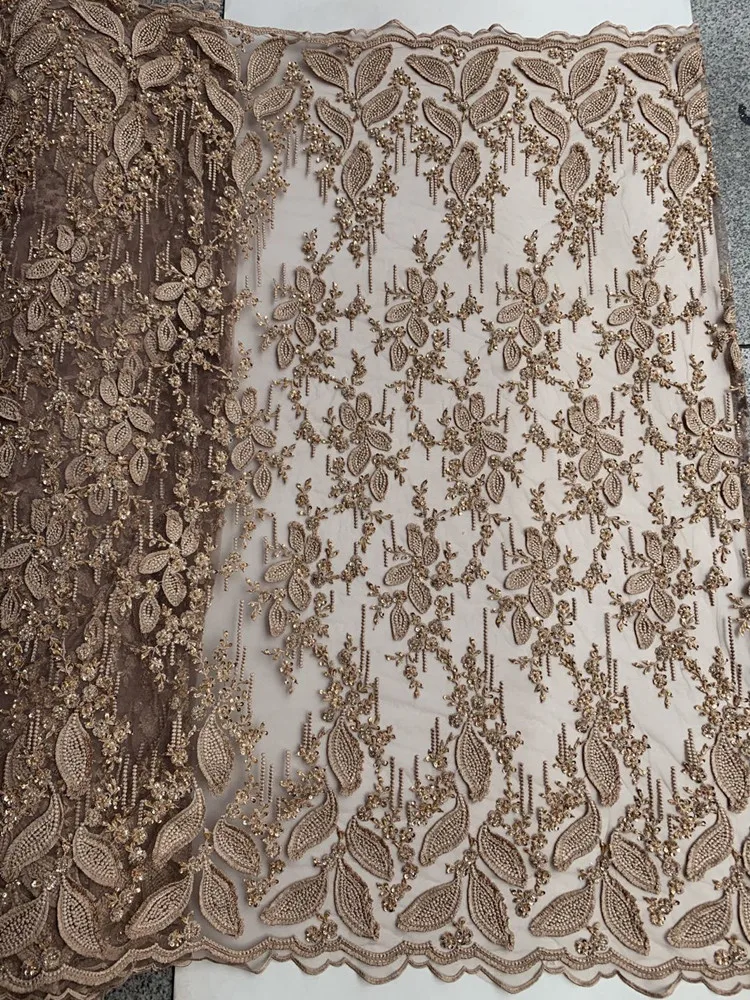 Gold fabric embroidery beads sequins French mesh yarn lace Kenya