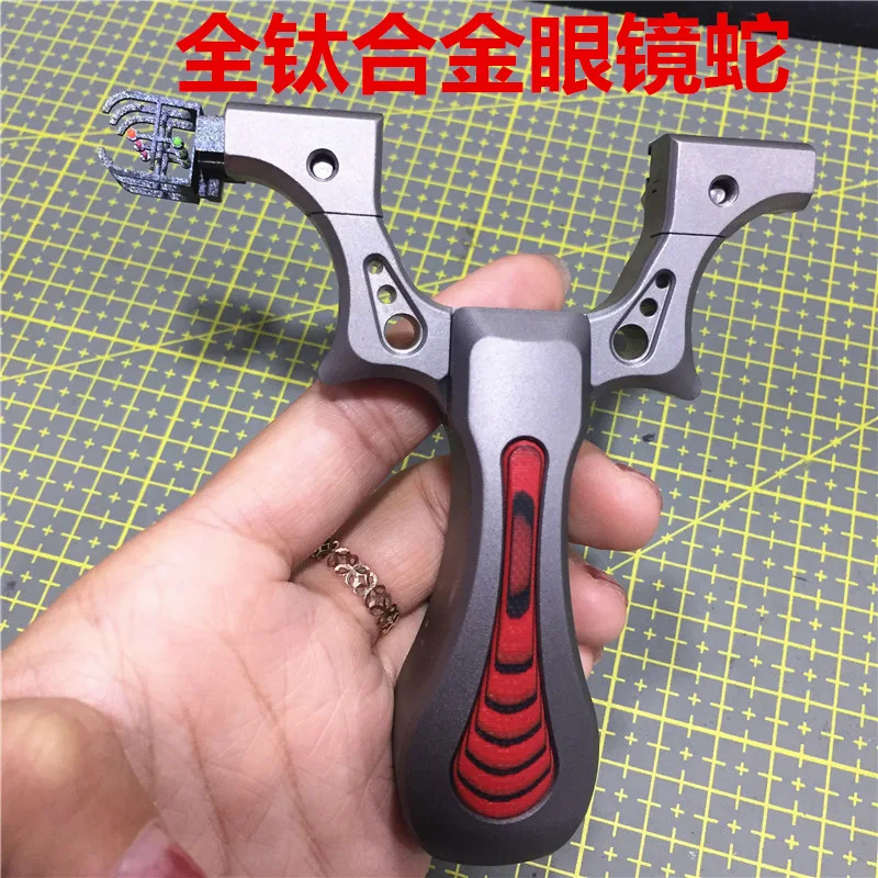 

New Products Titanium Alloy Cobra Fast Pressure Cross Calibration Aiming Flat Leather Slingshot High Quality Athletic Outdoor Fl