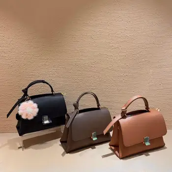 

New high quality leather fashion trend personalized simple British style postman's hand-held messenger bag women's bag