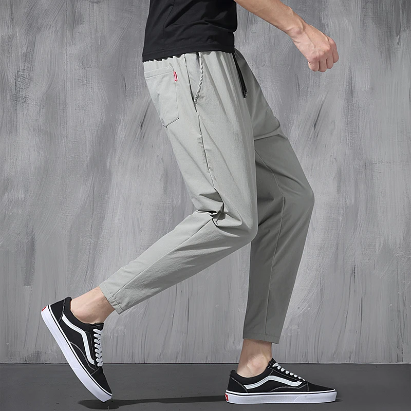2025 New Korean Ice Silk Elastic Trousers Four Seasons Thin Casual Men'S Loose 9-Point Large Size Small Foot Sports Pants Spring 2