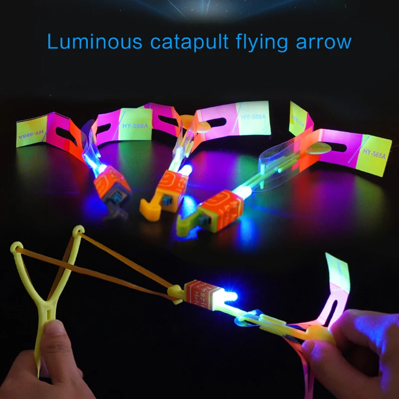 1 or 2Pcs Flashing Slingshot Kid Toy LED Light Slingshot Flying Arrow Catapult 