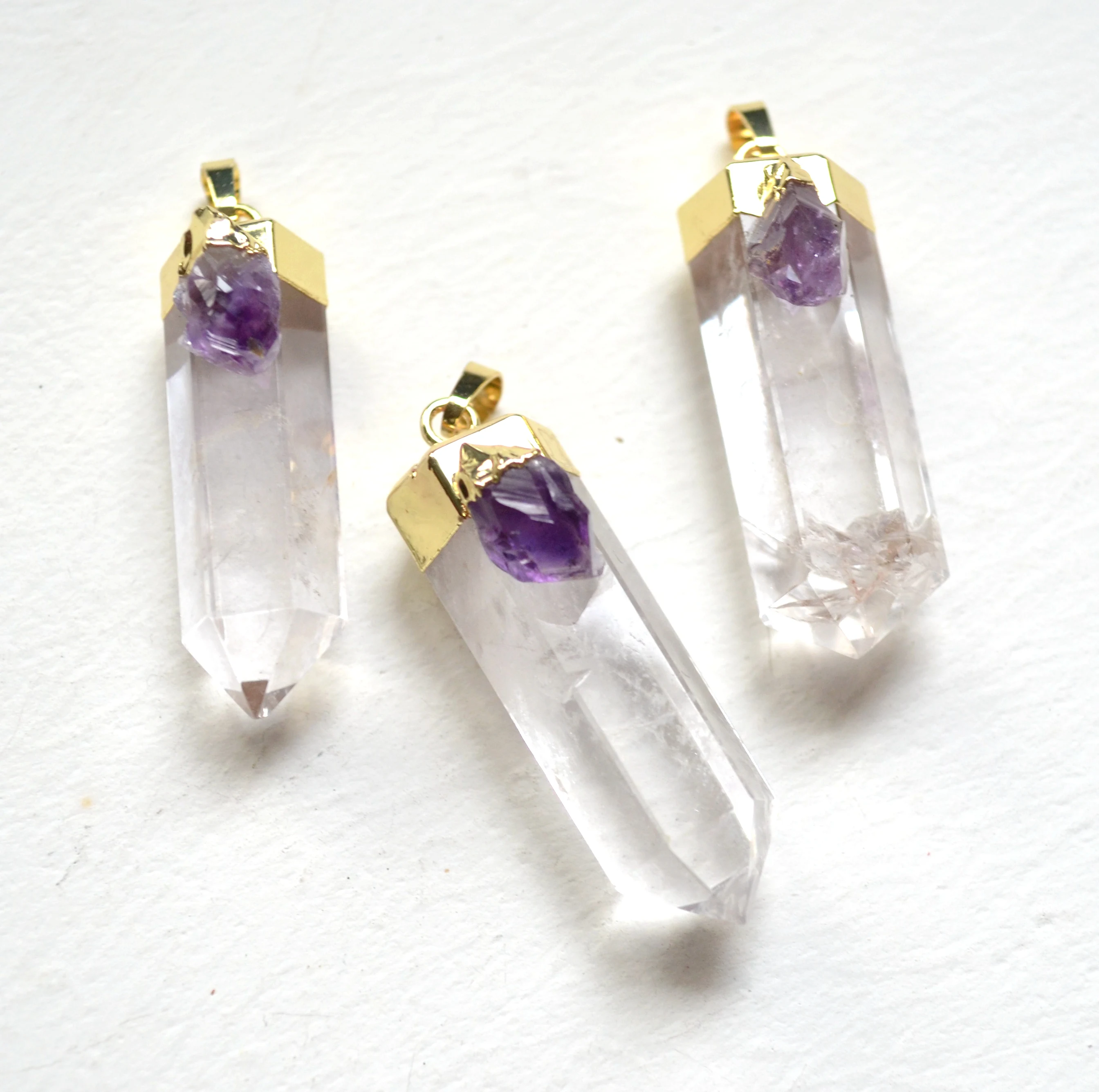 

New polished clear quartz crystal terminated point pendant with amethysts Electroplated gold edge