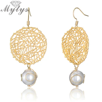 

Mytys Gold Color Hollow Leaf Design Pearl Drop Earrings For Women Trendy Fashion Statement Earrings CE647