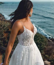 

Romantic Beach Wedding Dress 2021 A-Line Spaghetti Straps Lace Appliques Backless Sweep Train Bride Gown Vestidos De Noiva