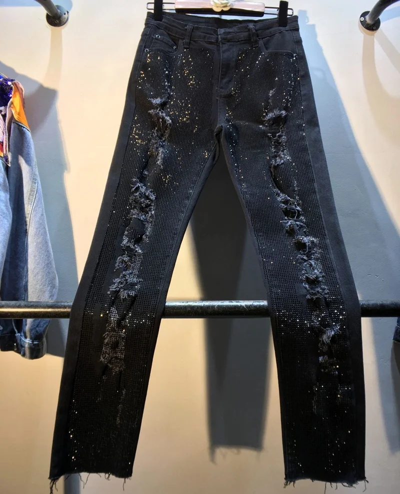 Европейский осень новые тяжелые горячие бурения Промытые воды высокая талия тонкие джинсы брюки женские отверстия стрейч карандаш брюки деним