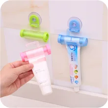 Tubo di plastica di Rotolamento Squeezer del Dentifricio in Supporto a Ventosa Dentale Crema Bagno Manuale Della Siringa Della Pistola Dispenser