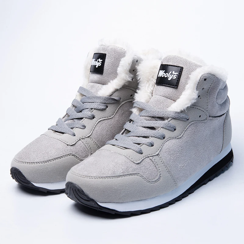 Botas de nieve cálidas de piel blanca para mujer, botines de talla grande a la moda, zapatillas de deporte informales para invierno