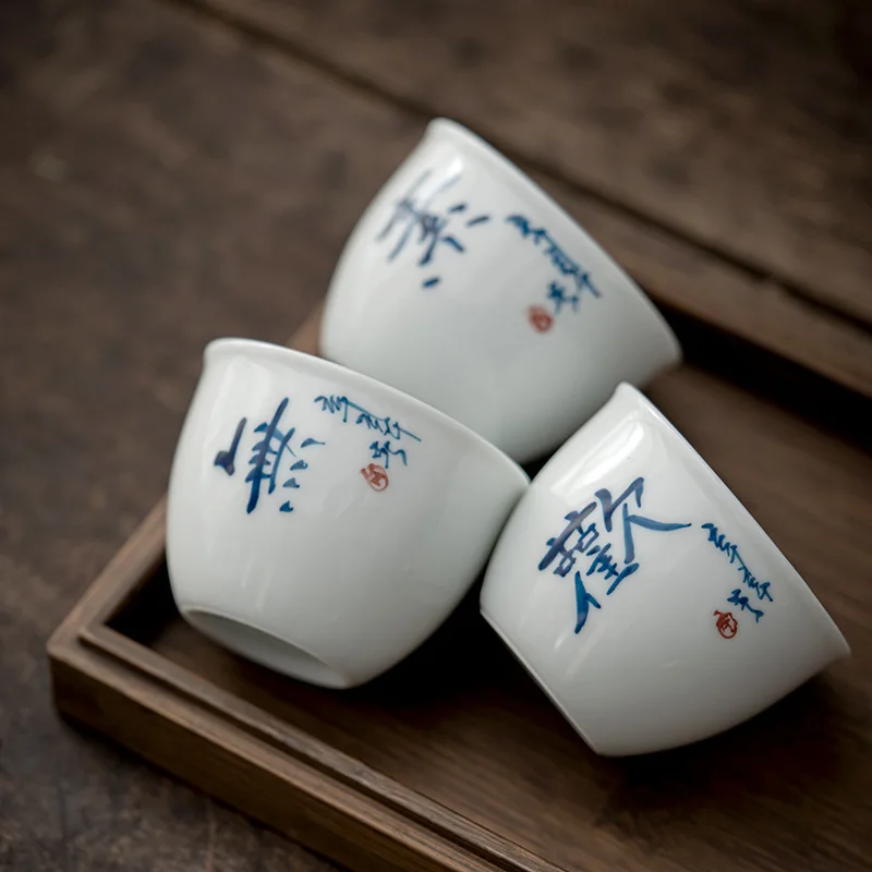 https://ae01.alicdn.com/kf/Hd5a541ee3fbc4183a3acbc7bf36ba126Q/2PC-Set-75ml-Hand-Painted-Calligraphy-Art-Ceramic-Sample-Tea-Cup-White-Porcelain-Master-Cup-Household.jpg