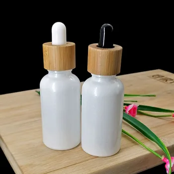 

30ml pearl white essential oil dropper bottle cosmetic glass pipette packaging container with wood grain bamboo lid cap