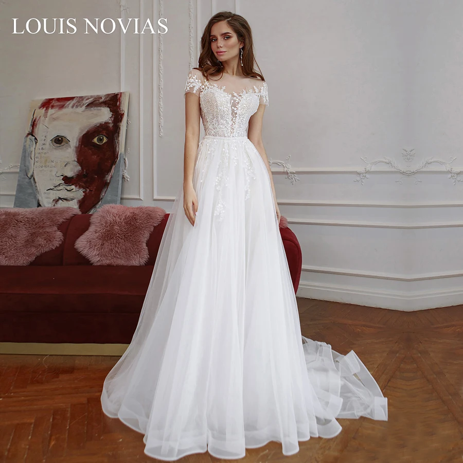 

Louis Novias Sexy Boat Neck Beaded Elegant Lace Decal 2020 Twist Button Flower African Luxury Auditorium Romantic Wedding Dress