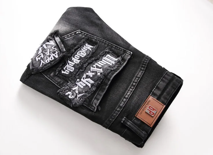 European and American street trends washed and worn holes embroidered tiger letters embroidered men's slim feet stretch jeans