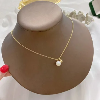

European and American Minimalist Creative Natural Freshwater Pearl Necklace Retro INS Wind Spirit Dynamic 14k Bag Gold Necklace
