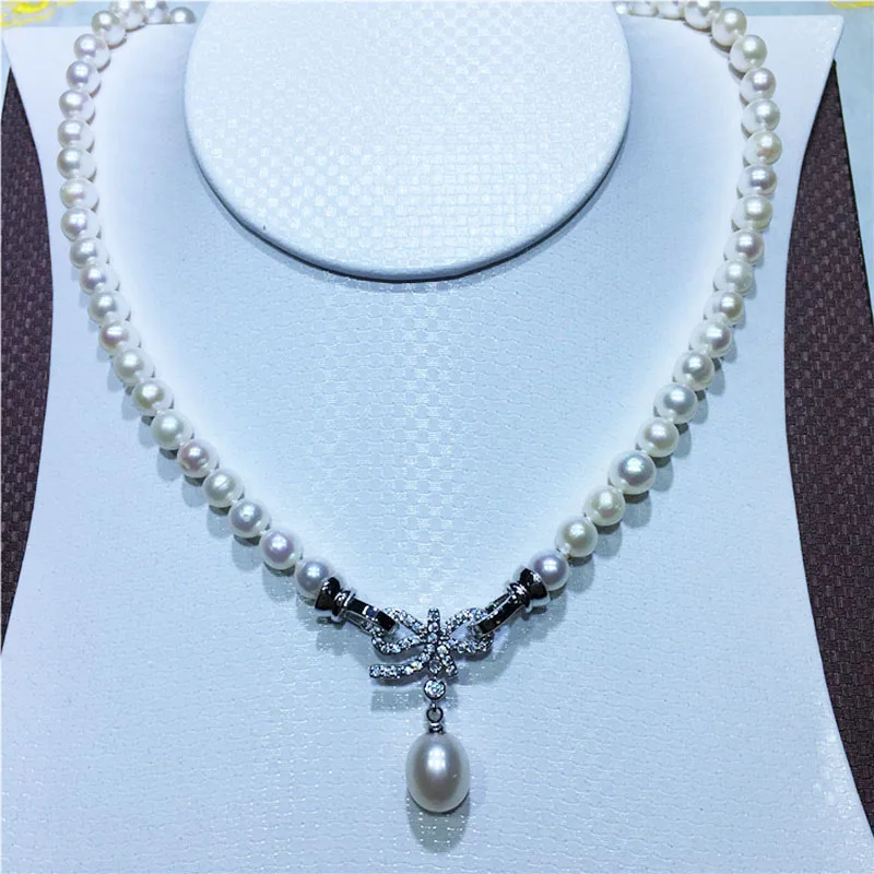 

MADALENA SARARA 7-12mm Near Round White Freshwater Pearl Pendant Women Necklace Bow-knotted Cubic Zircon Pave Setting