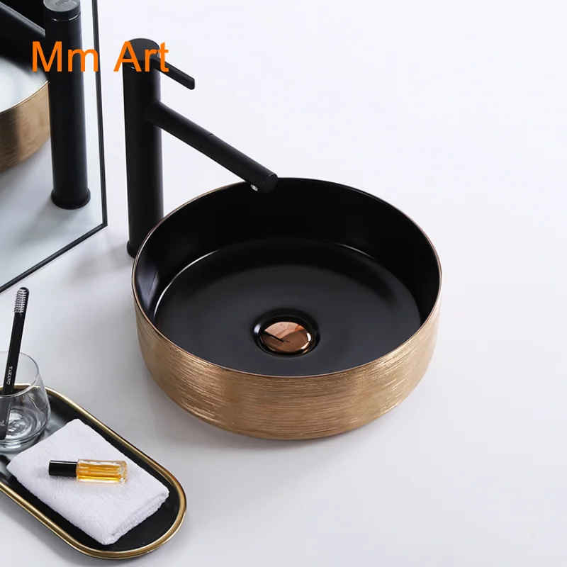 

Vanity luxury gold and black color hotel washroom small round art washbasin ceramic table top bathroom sink hand wash basin