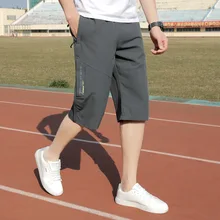 Men's Summer Leisure Gym Jogger Sports Pants Ice Silk Air-conditioned Quick-dry Fitness Seven-minute Pants Loose Trousers Men's Summer Leisure Gym Jogger Sports Pants Ice Silk Air-conditioned Quick-dry Fitness Seven-minute Pants Loose Trousers