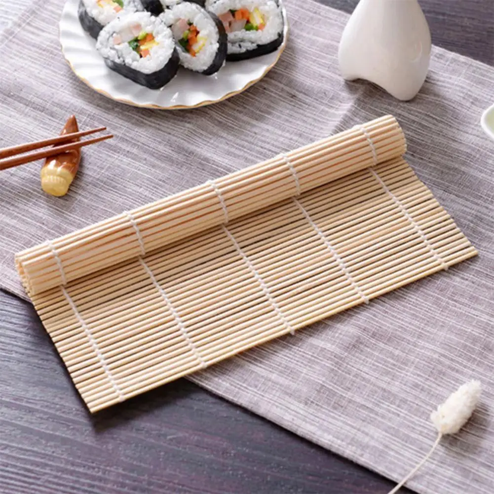 Premium Photo  Seaweed sushi on bamboo mat chopsticks on table