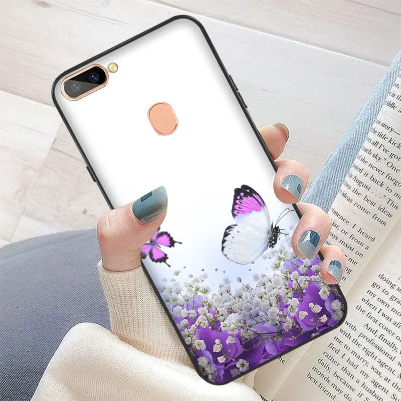 Red butterfly on white roses flower