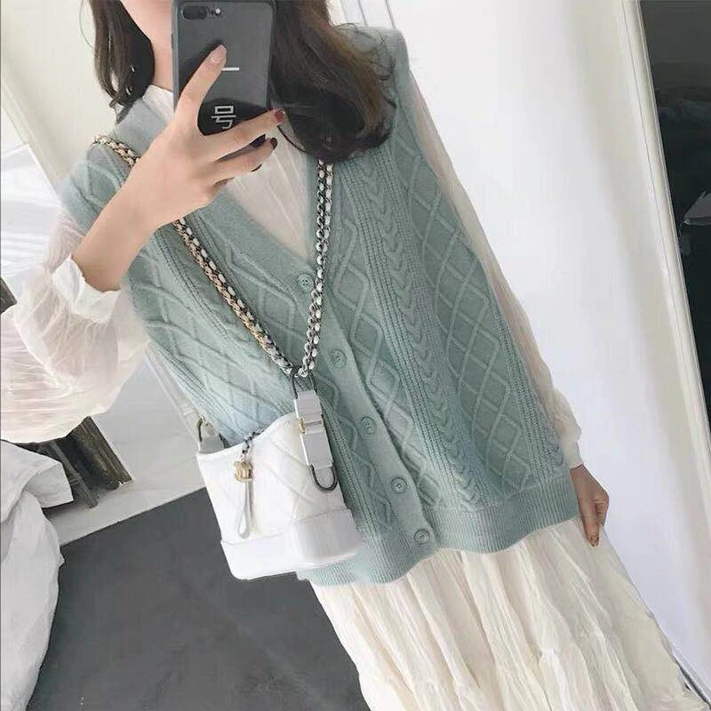 green sleeveless cardigan
