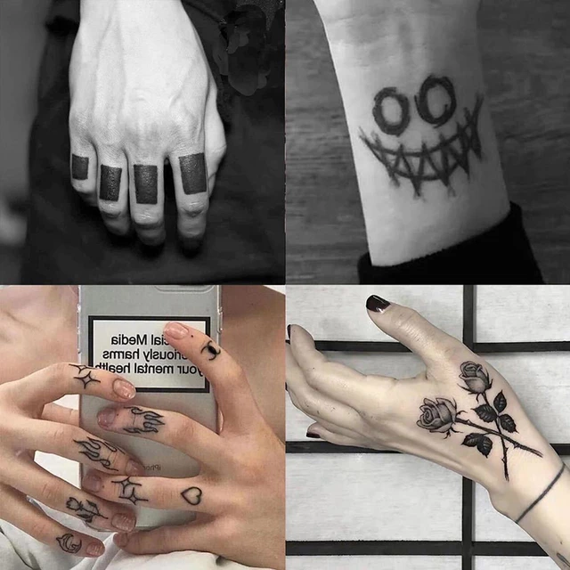 Person with black leaves finger tattoos photo  Free Grey Image on Unsplash