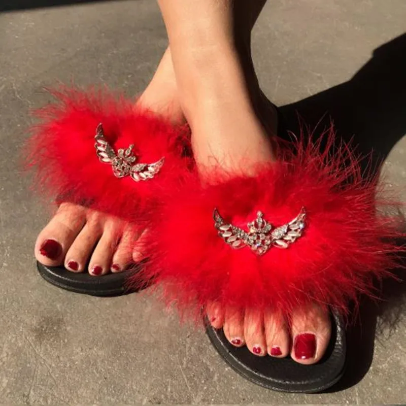 red mules with ostrich feathers