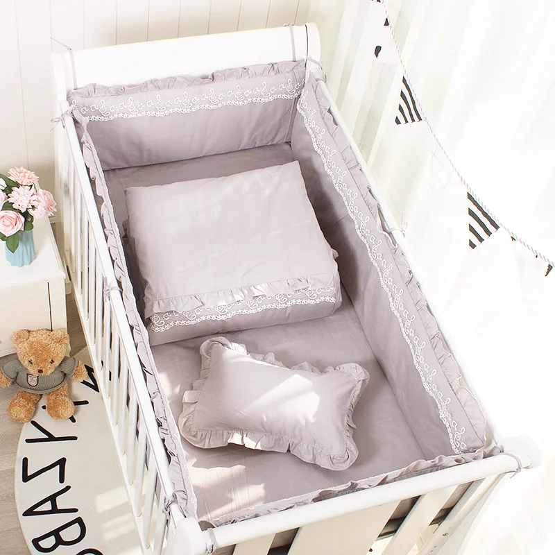 grey and white cot bedding
