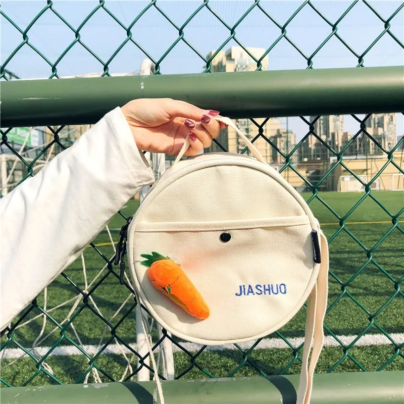 

Carrot bag female 2020 new small round bag Korean fashion wild transparent canvas bag girl shoulder messenger bag female