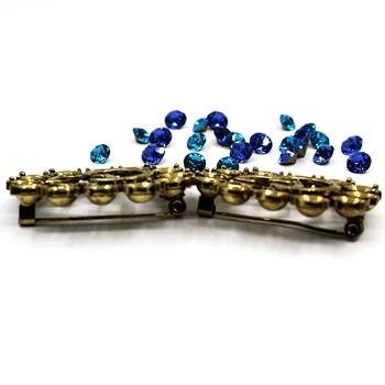 

1Pcs fashion gold brooch, two lake blue and royal blue rhinestones are available