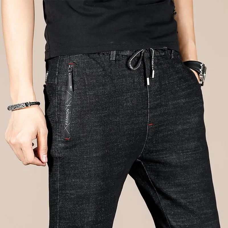 

Autumn men's stretch jeans Korean style feet casual trend pencil elastic waist blackmen joggers pants