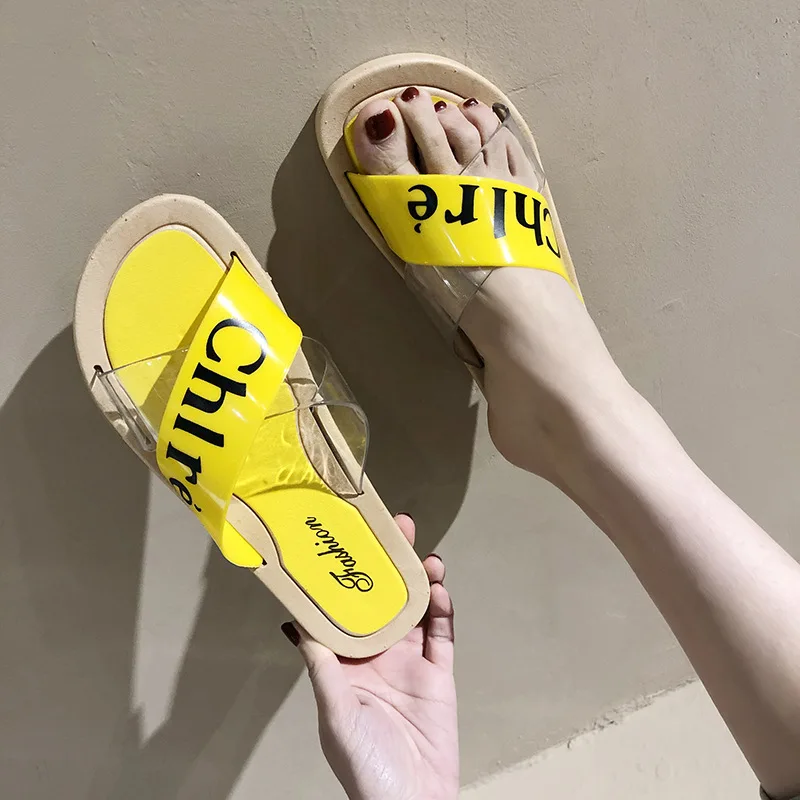 

2020 summer new transparent cross letter slippers women's shoes solid color rubber flat heel flat bottom simple shoes
