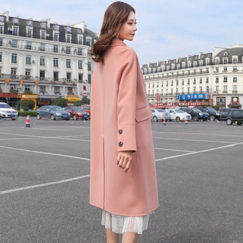 Woolen coat female long section winter new Korean version of the loose popular temperament trumpet buckle woolen