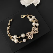 

Brand Trend Jewelry Bow Knot Pearl Diamond Inlaid Double Row Chain Bracelet Real Gold Plating Platinum And Rose GoldJewellery