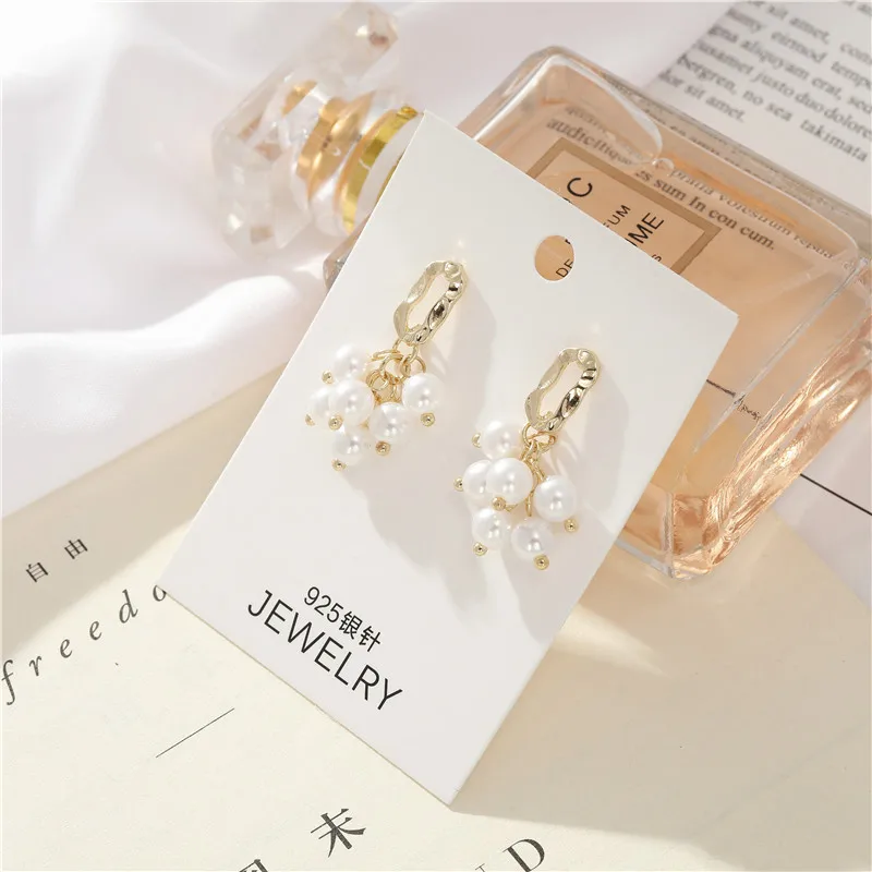 

The United States and South Korea edition contracted 925 needle geometry pearl earring web celebrity same style ins wind earring