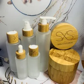 

10pcs Wholesale 50ml Frosted Glass Bottle Glass jar with spray bamboo caps Empty Cosmetic Toner Bottles